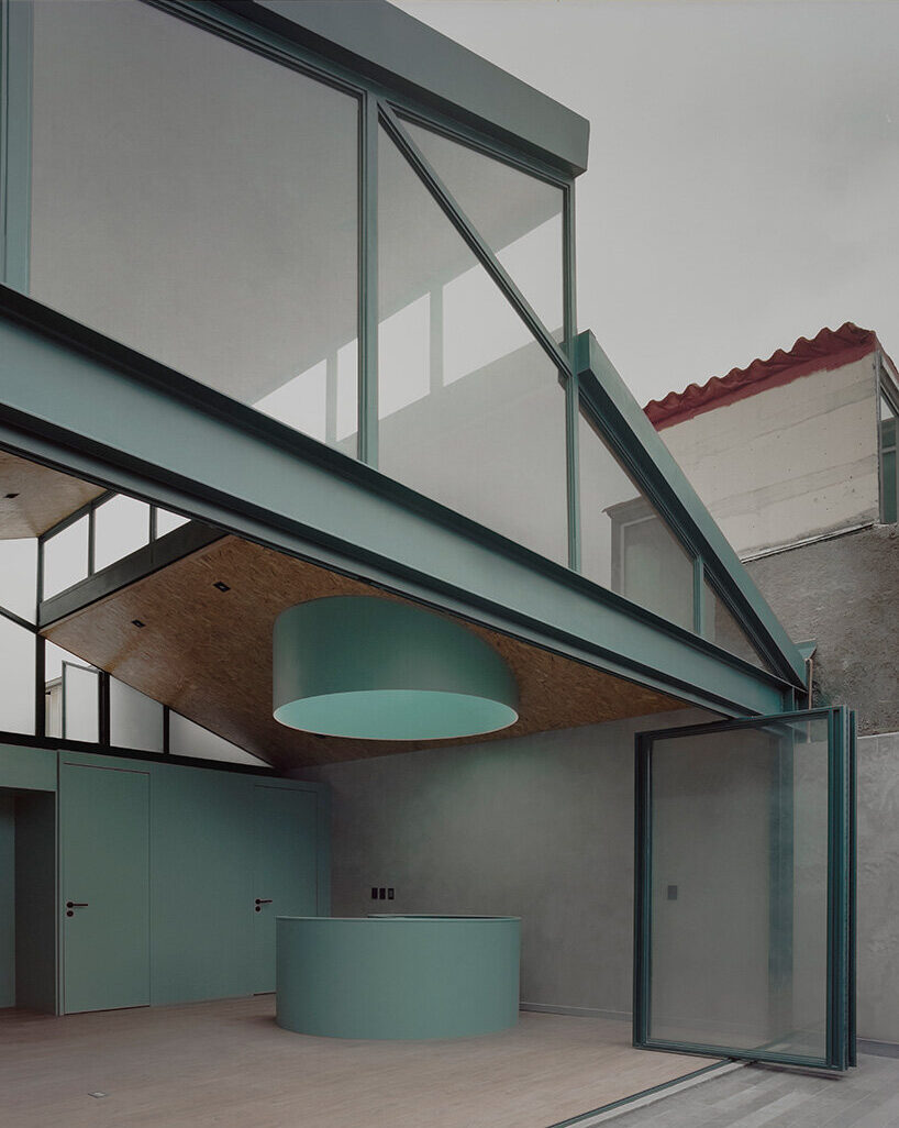 green metal accents bring color to amasa estudio's 1940s home renovation in mexico city
