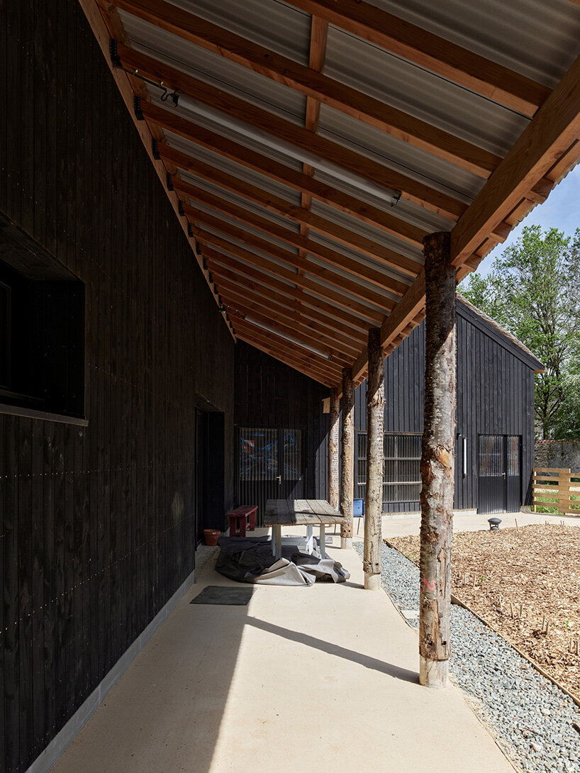 guinee*potin's agro-ecological park revives french site through timber and translucent skins