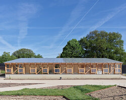guinee*potin's agro-ecological park revives french site through timber and translucent skins