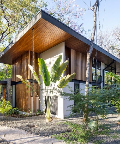 warm teak encloses garton group architecture's tropical indo avellanas villas in costa rica