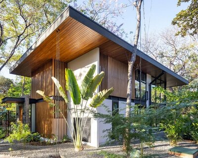warm teak encloses garton group architecture's tropical indo avellanas villas in costa rica
