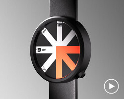 colored arrow dial rotates over eight transparent dividers in ion lucin's arrowatch