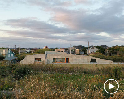 concrete isumi villa by takeshi hosaka architects organically spreads over land in japan