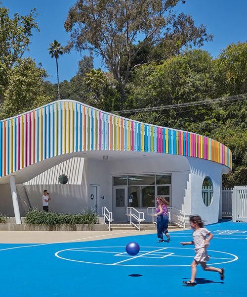 colored louvers wrap around los angeles elementary school's curved exterior by JFAK