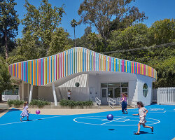 colored louvers wrap around los angeles elementary school's curved exterior by JFAK