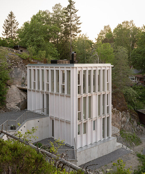 kolman boye architects tucks minimalist 'ravine house' into steep swedish landscape