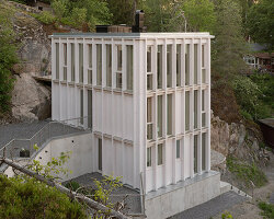 kolman boye architects tucks minimalist 'ravine house' into steep swedish landscape