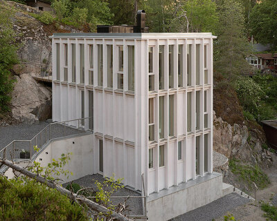 kolman boye architects tucks minimalist 'ravine house' into steep swedish landscape