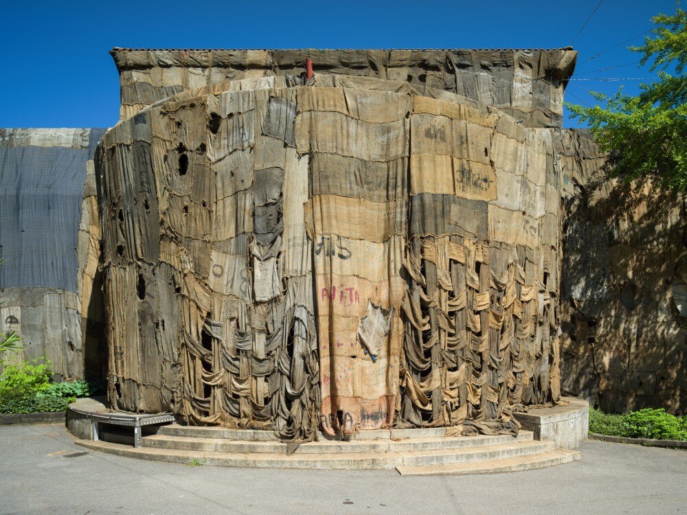 ibrahim mahama wraps kunsthalle bern in jute sack veil, confronting histories of labor & trade