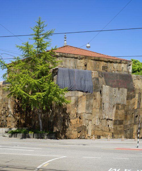 ibrahim mahama wraps kunsthalle bern in jute sack veil, confronting histories of labor & trade