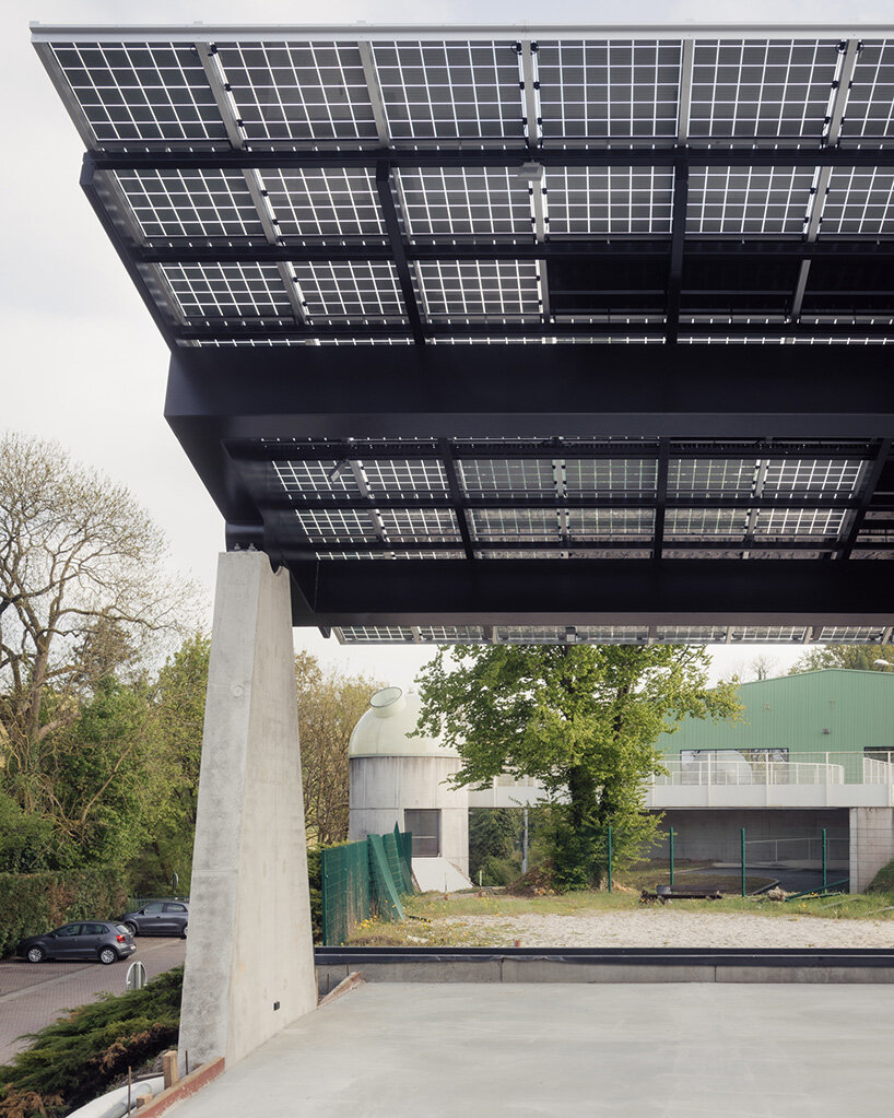 label crowns elevated walkway with telescope-like dome in belgian sports center renovation