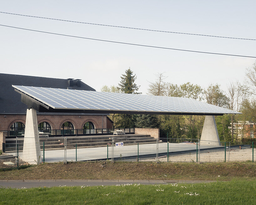 label crowns elevated walkway with telescope-like dome in belgian sports center renovation