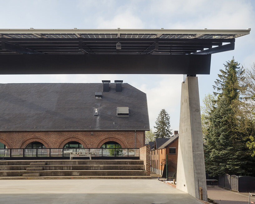 label crowns elevated walkway with telescope-like dome in belgian sports center renovation