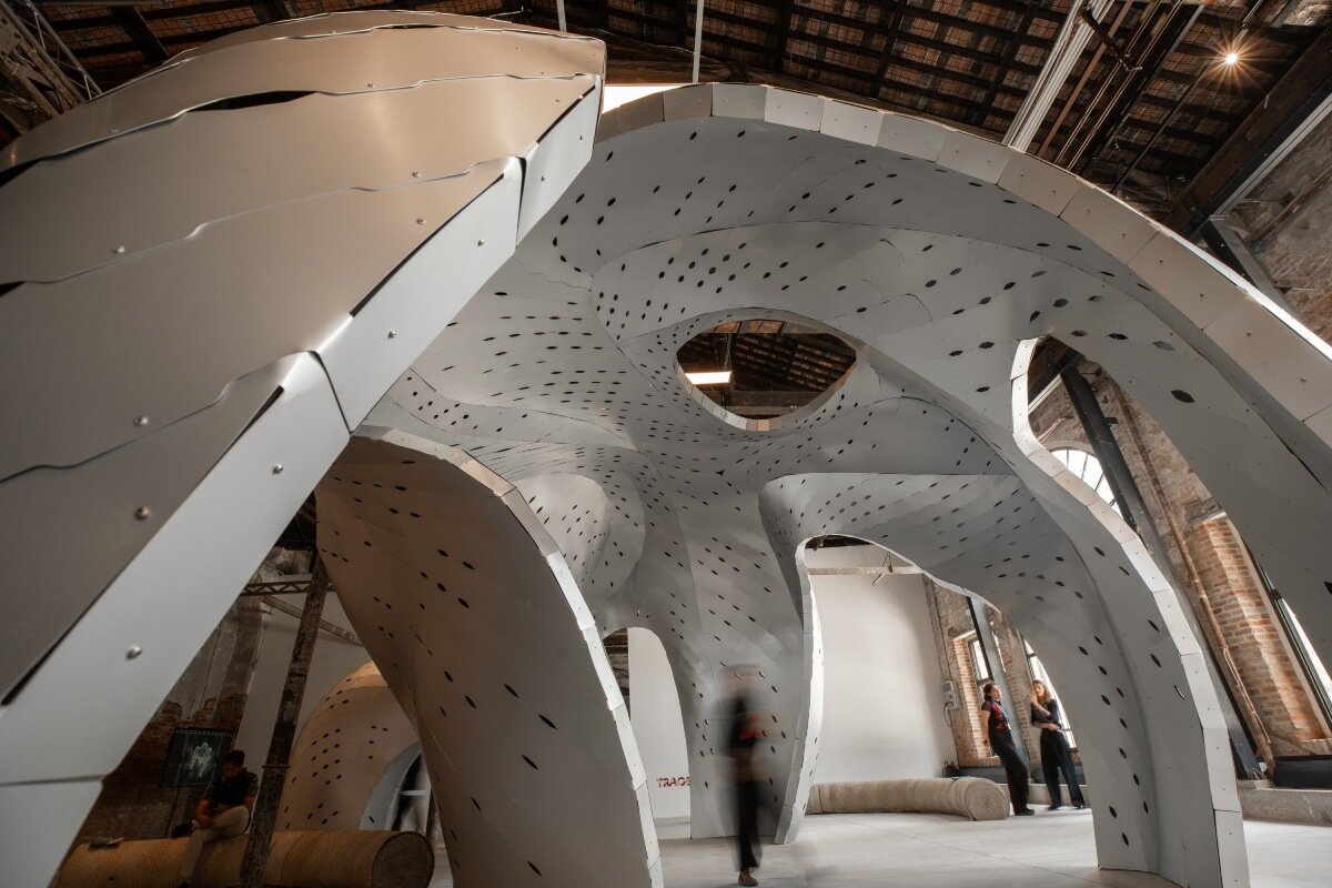 inaugural oman pavilion reimagines traditional gathering spaces as sinuous aluminum shelter