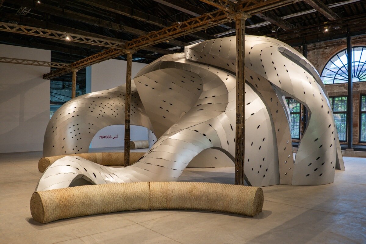 inaugural oman pavilion reimagines traditional gathering spaces as sinuous aluminum shelter