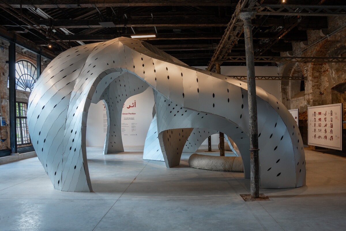 inaugural oman pavilion reimagines traditional gathering spaces as sinuous aluminum shelter