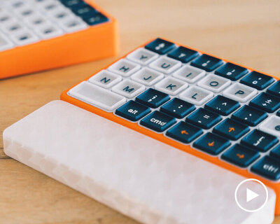 this is oncue, a modular keyboard with wearable haptic cuffs for people with parkinson’s