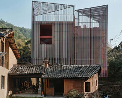 rural art museum's aluminum lattice facade by team_bldg shimmers above chinese village