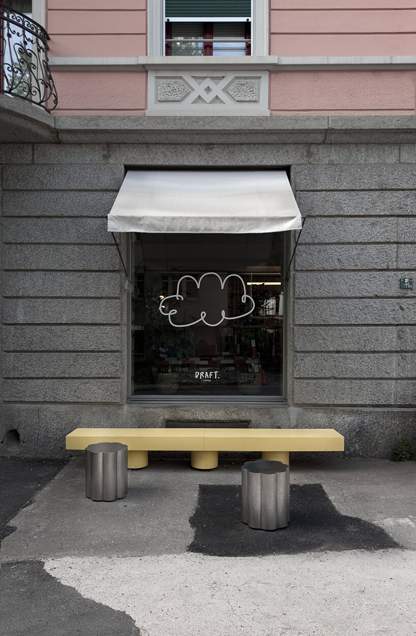 RDZ studio sculpts soft futurism into zurich café with floating cloud bar and tactile interiors