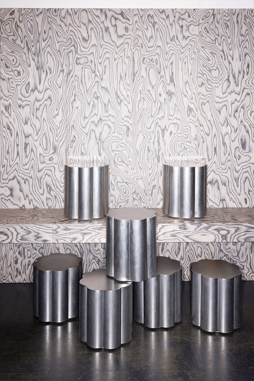 RDZ studio sculpts soft futurism into zurich café with floating cloud bar and tactile interiors