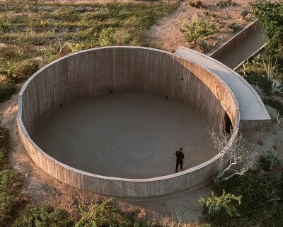 concrete ring wraps around rubén valdez practice's spiritual enclosure in mexico desert