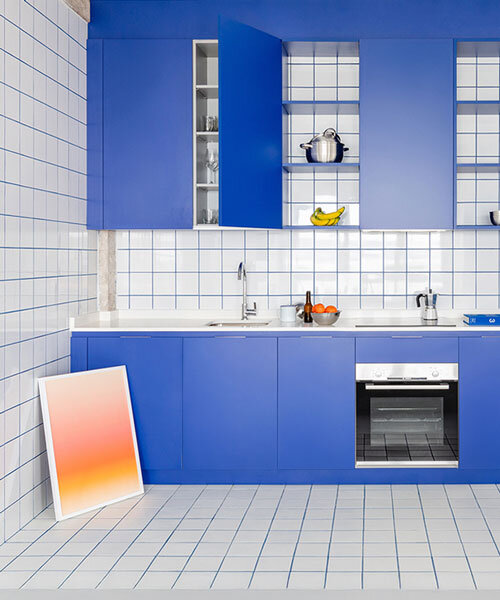 blue and white interiors link renovated 1930s apartment to its seaside setting in spain