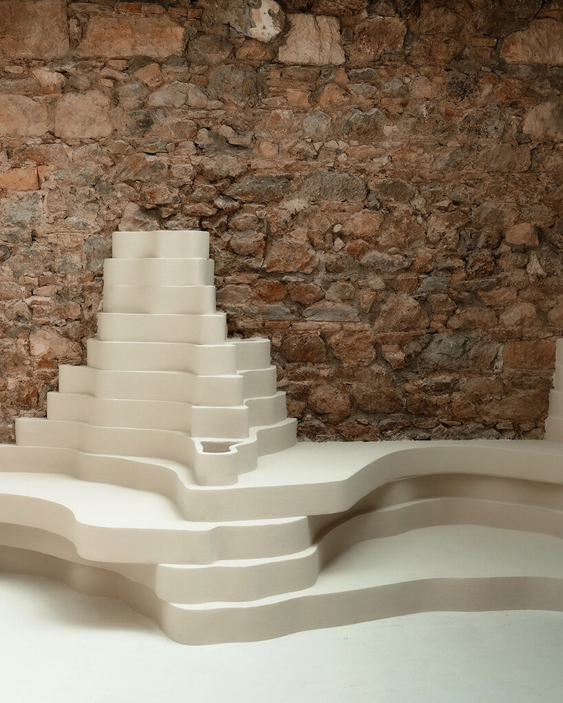 snarkitecture's burger bar takes form in athens with creamy, canyon-like interiors