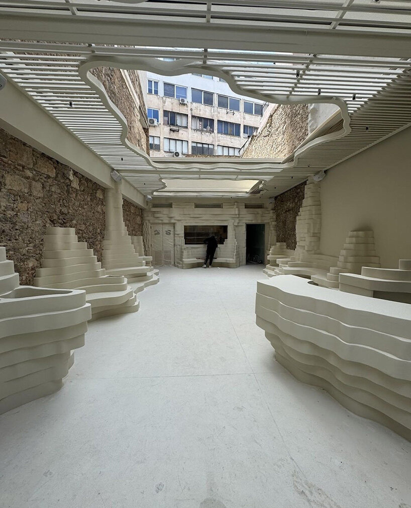 snarkitecture's burger bar takes form in athens with creamy, canyon-like interiors