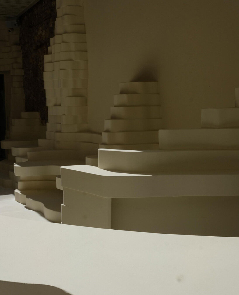 snarkitecture's burger bar takes form in athens with creamy, canyon-like interiors