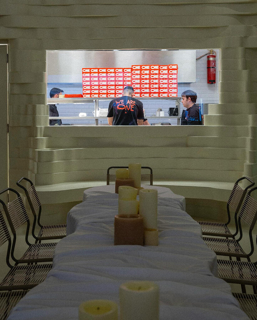 snarkitecture's burger bar takes form in athens with creamy, canyon-like interiors