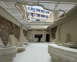 snarkitecture sculpts creamy contours into canyon-like athens burger spot