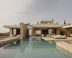 k-studio's 'southwand house' follows the sloping olive groves of messinia, greece