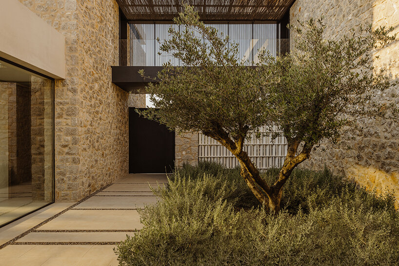 k-studio's 'southwand house' follows the sloping olive groves of costa navarino in greece