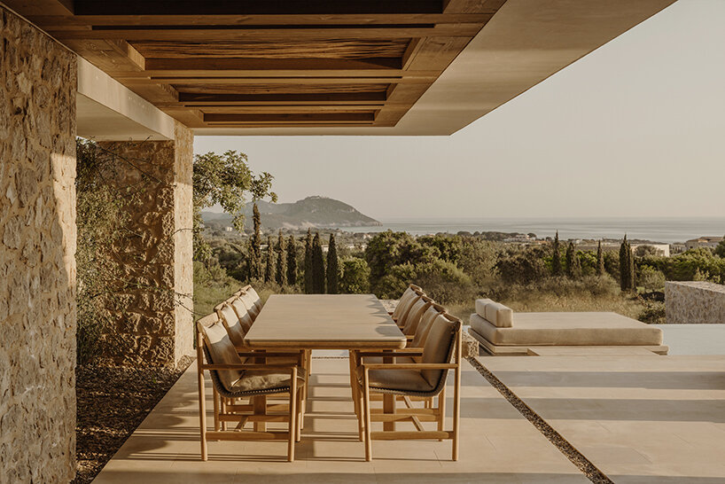 k-studio's 'southwand house' follows the sloping olive groves of costa navarino in greece