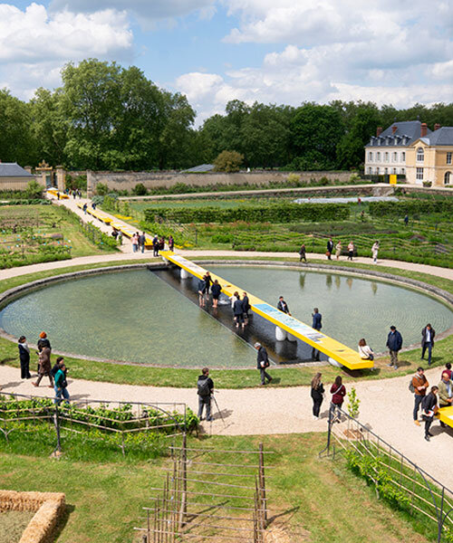 studio 5•5 stretches linear table through versailles' gardens as open dialogue on climate