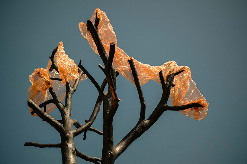 thanos zakopoulos transforms fallen pine into fiery symbol of rebirth at ekies resort in greece