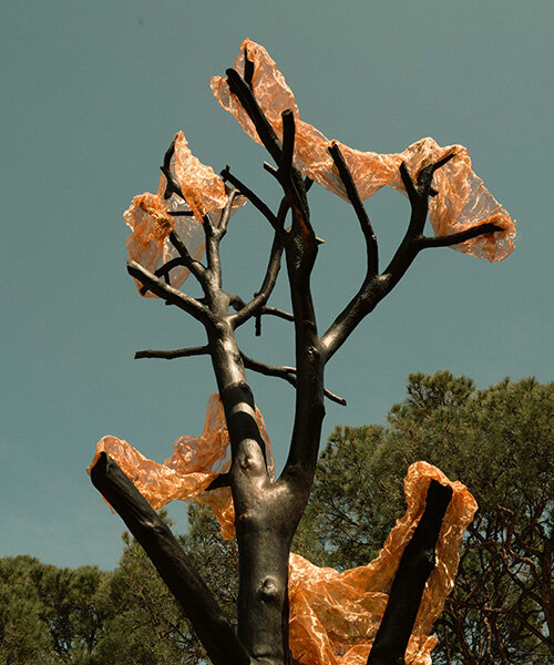 thanos zakopoulos transforms charred pine into fiery symbol of rebirth at greek resort