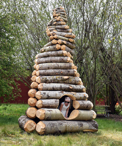 timber twist by ulf mejergren reimagines larvae shelter as spiraling log cabin
