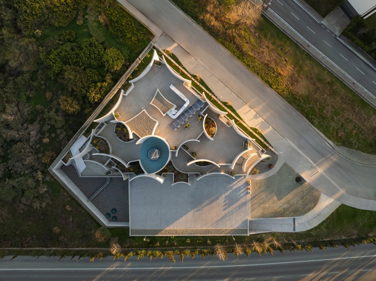 davide macullo's veterinary clinic hides behind a cluster of concrete curves in albania
