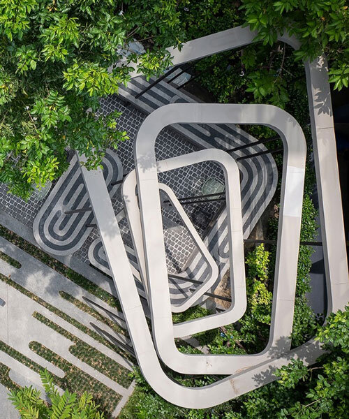 fingerprint patterns inform sculptural landscape design within bangkok housing complex