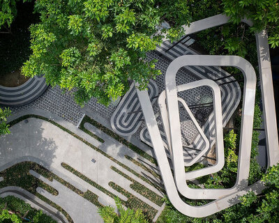 fingerprint patterns inform sculptural landscape design within bangkok housing complex