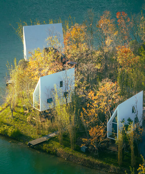 wood-clad cabins by wiki world stand on stilts like sailboats along wuhan's shoreline