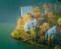 wood-clad cabins by wiki world stand on stilts like sailboats along wuhan's shoreline