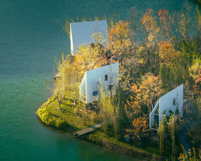 wood-clad cabins by wiki world stand on stilts like sailboats along wuhan's shoreline
