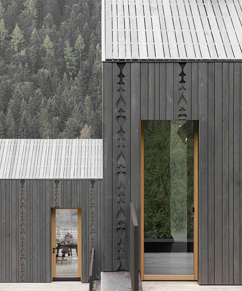 intricate alpine details carved throughout 'zierhof with parlor' by NAEMAS architekten