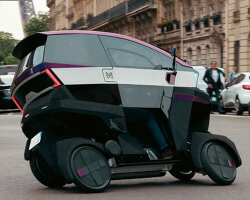 Æ motion’s tilting electric motorcycle has four wheels that bend when turning corners