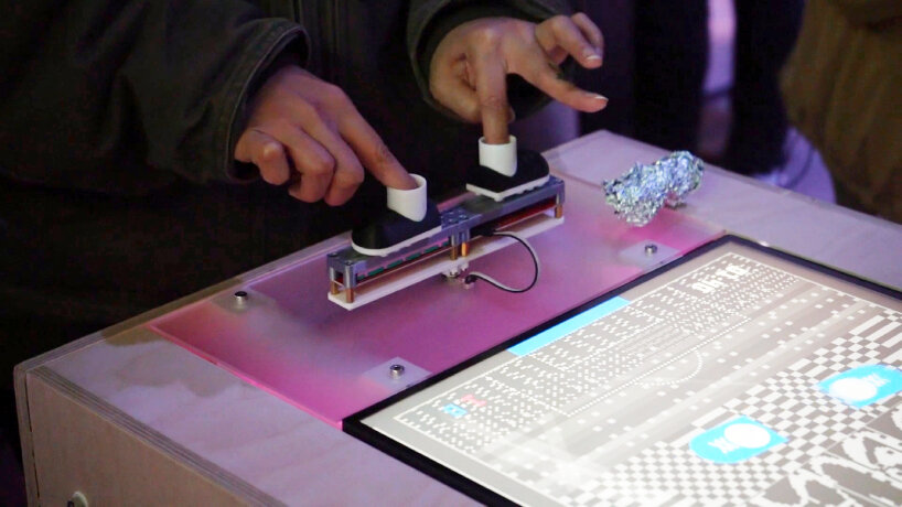 the device is a modern spin on the Pong game and tabletop foosball play