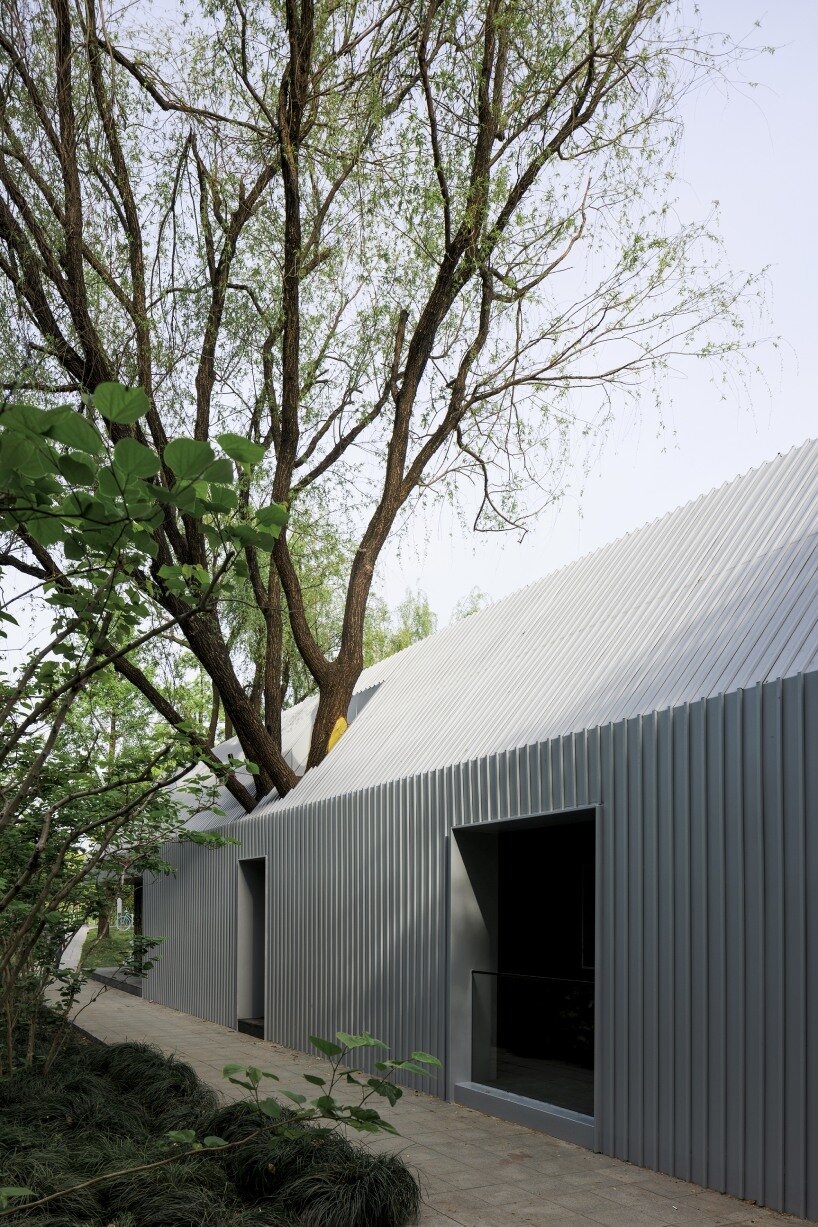 wutopia lab's prefabricated waterfront pavilion in shanghai wraps in aluminum & ceramic skin