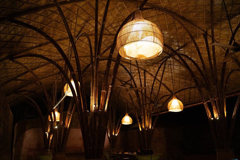 arched bamboo roof shades learning space in bali co-designed by students and mizzi studio