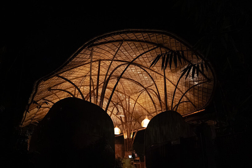 arched bamboo roof shades learning space in bali co-designed by students and mizzi studio